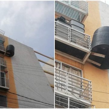 (FOTOS) Vecinos en CDMX cuelgan tinaco en balcón del 5to piso