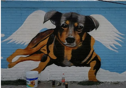 Dedican mural a ‘Scooby’, perrito arrojado a cazo de aceite hirviendo