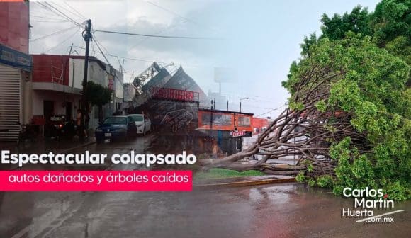Un espectacular colapsado, vehículos varados y árboles caídos, saldo de la lluvia de este martes