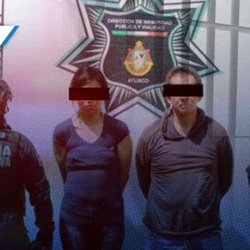 Detienen a pareja en vehículo robado y arma de fuego en Atlixco