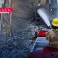 Tras 18 horas de labores, Protección Civil liquida incendio en bodega